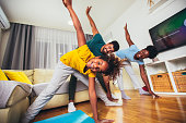 istock Healthy morning stretching - family doing gymnastic exercise at home 1353350829