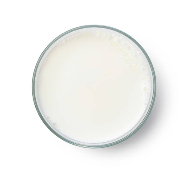 istock Milk in a glass placed on a white background. View from above. 1353351941