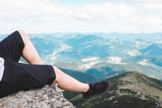 istock legs on the top of the peak 1353351987