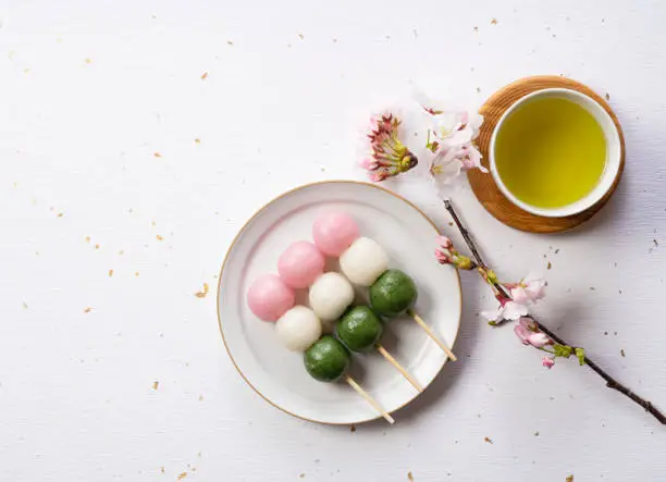 Sanshoku dango and green tea. The image of spring in Japan. View from above
