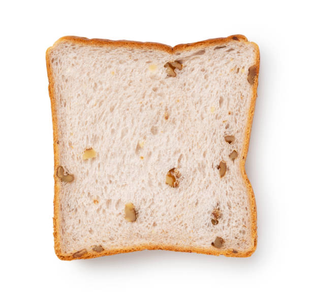 istock Walnut squares of bread placed on a white background 1353356114