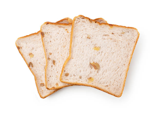 istock Walnut squares of bread placed on a white background 1353356118