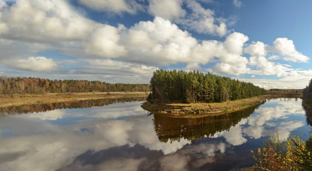 istock Beautiful river bend, peninsula, forest, clouds and reflection on a sunny autumn day 1353356508