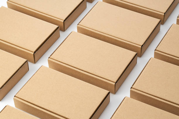 istock Neatly arranged cardboard boxes on a white background. Shipping Concept 1353357323