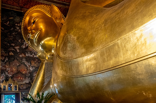 The famous Reclining Buddha at Wat Pho temple. Phra Nakhon District. Bangkok. Thailand.