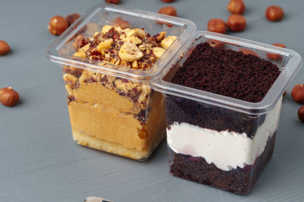 istock Creamy dessert in a plastic box on gray table 1353360650