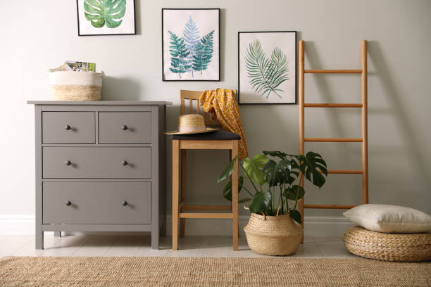 istock Stylish room interior with decorative ladder and monstera plant 1353362349