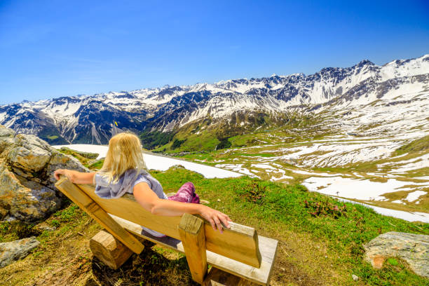 istock Woman in Aroser Weisshorn peak 1353364090