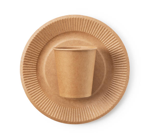 istock Disposable paper cups and plates on a white background. 1353364317