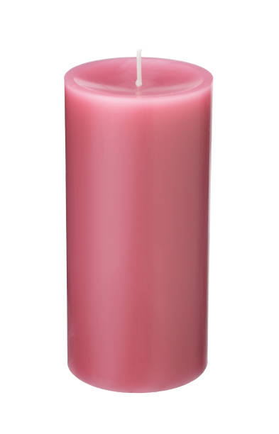 istock A single pink candle on a white background. 1353364518