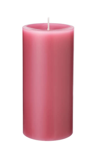 istock A single pink candle on a white background. 1353364531