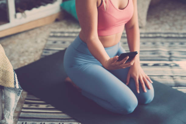 istock Midsection Of Woman Using Mobile Phone 1353364679