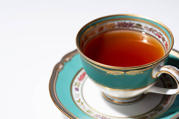 hot tea in an antique cup and saucer on a white background with copy space - isolated isolated on white copy space antique imagens e fotografias de stock