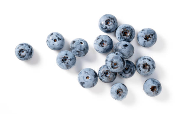 istock Blueberries and blueberry leaves on a white background. 1353367093