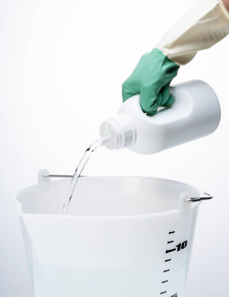 istock Pour the detergent into the bucket. 1353367390