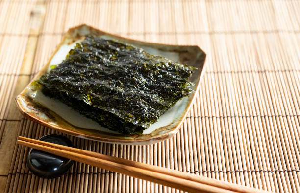 istock Korean seaweed served on a plate on a wooden table. 1353368305