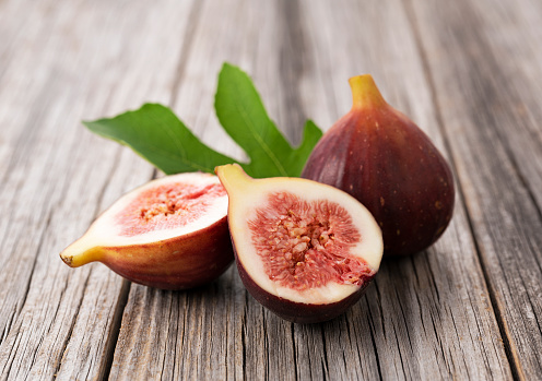 A large fig tree with ripening fruit