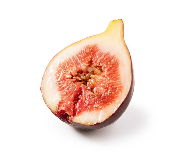istock Figs cut in half, placed on a white background. Close-up. 1353368407
