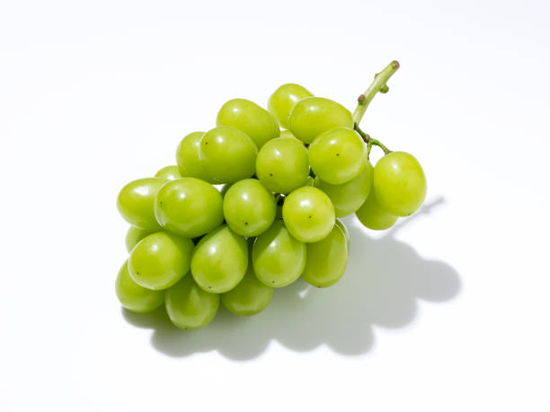 istock Shine Muscat grapes on a white background. White grapes. Japanese grapes. 1353368454