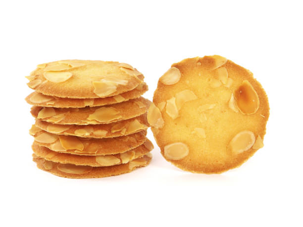 istock Pile of almond flake cookies isolated on white 1353368717