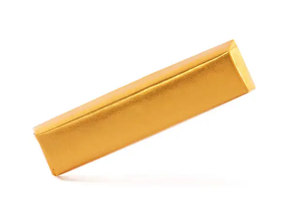 Chocolate bar wrapped in golden aluminum foil isolated on white background, sweet food