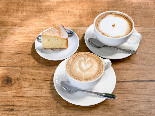 istock Latte coffee and brown cake 1353368999