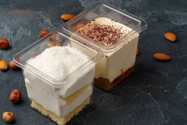 istock Creamy dessert in a plastic box on gray table 1353370027