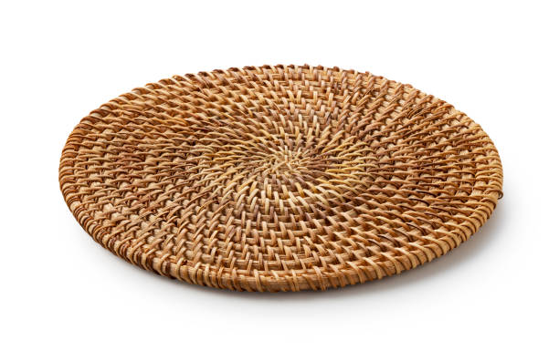 handmade round woven placemat placed on a white background. - woven wood textured place mat imagens e fotografias de stock