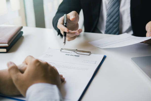istock The interview room while the staff is preparing the resume document and presenting to the manager who is talking and analyzing about the work experience. 1353370241