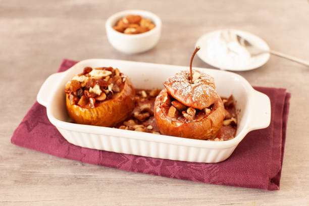 istock Baked winter apples with raisins, almonds and honey 1353373278
