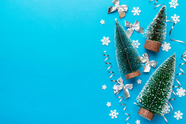 istock Flat lay composition with christmas trees on color background. Top view with copy space 1353373482