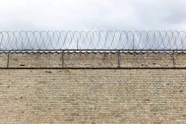 Photo of Barbed wire wall of a prison in Denmark