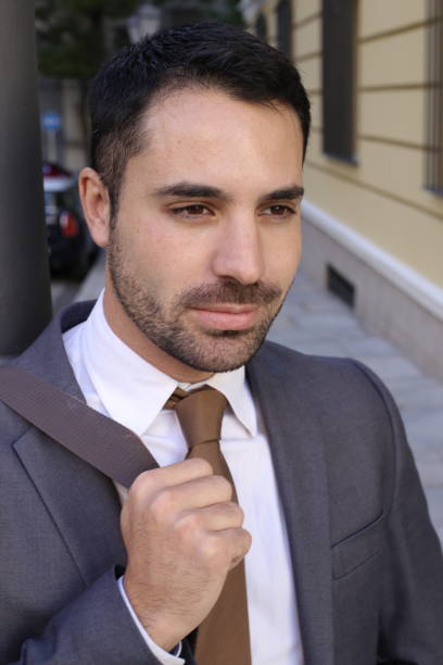 istock Handsome ethnic businessman close up 1353378535