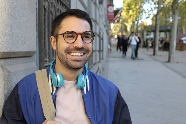 istock Handsome adult student walking outdoors 1353378657
