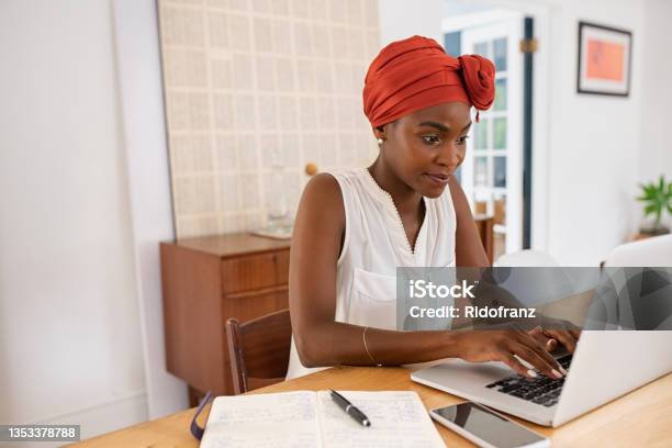 Mature African American Woman Working On Laptop From Home Stock Photo - Download Image Now