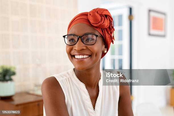 Happy Smiling Black Woman With Spectacles Wearing African Turban Stock Photo - Download Image Now