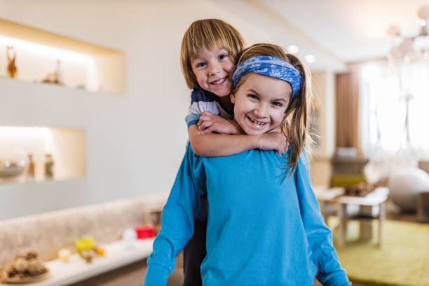 istock Happy little brothers embracing at home. 1353378876