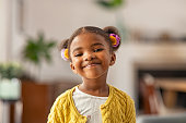 istock Cute little african american girl looking at camera 1353379172