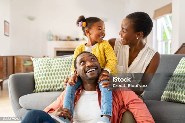 Little Black Girl Playing With Parents At Home Stock Photo - Download Image Now - Family, African-American Ethnicity, African Ethnicity