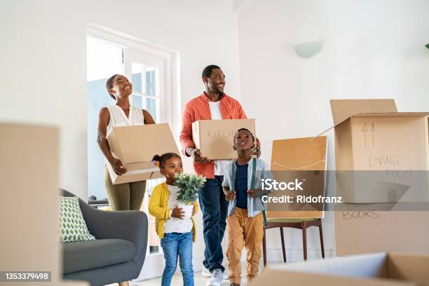 Black Family With Two Children Moving House Stock Photo - Download Image Now - Moving House, Family, Relocation