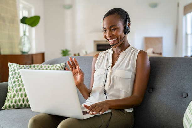 istock Mid african american woman using laptop for video call to work 1353379570