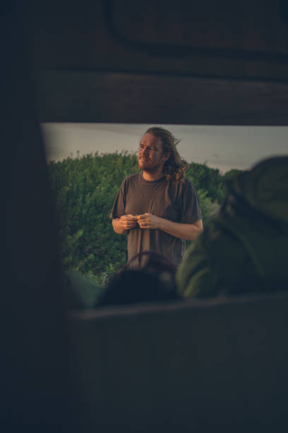 istock Man closes back door of motorhome 1353379595