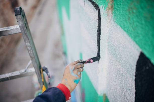 istock Street artist drawing on wall 1353380350