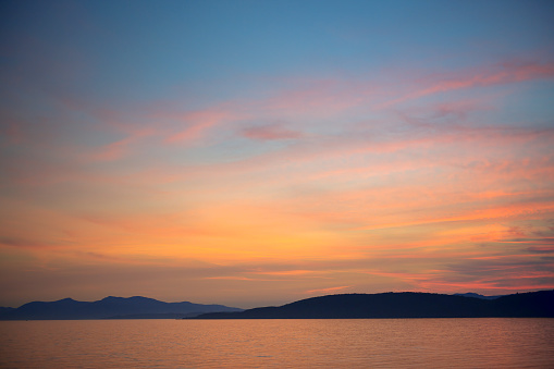 Sunset over Ardmucknish Bay from the beach at North Ledaig, Argyllshire, Scotland.