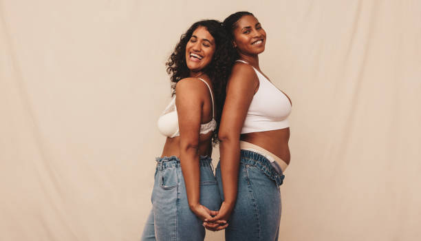 istock Friends holding hands and smiling in a studio 1353381797