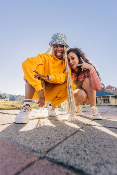 istock Young female friends posing for the camera 1353382078