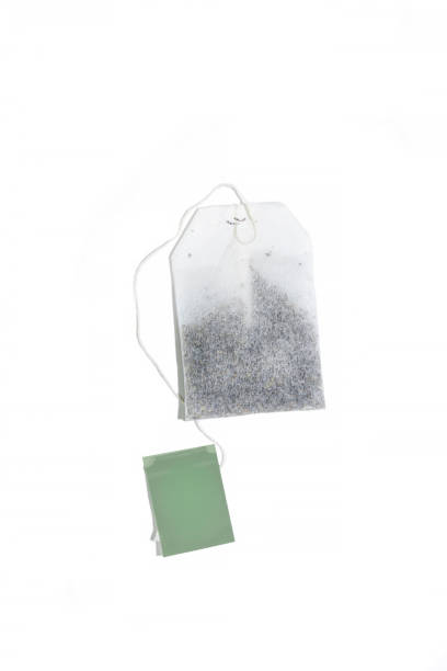 istock Teabag with green tea Isolated on white background. Mock up 1353382194