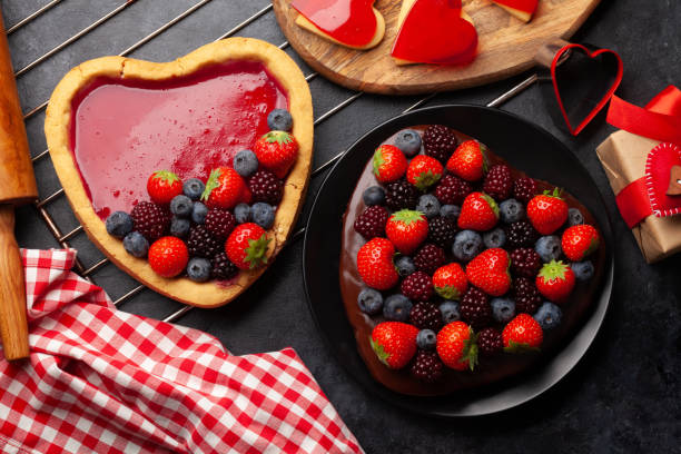 istock Heart shaped sweet cake with berries 1353383573