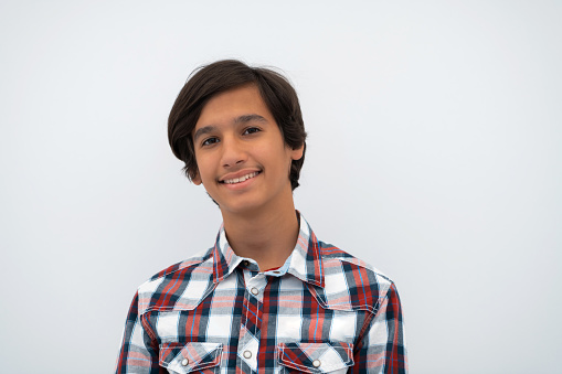 a portrait of a young attractive Arab boy isolated on a white background. High quality photo