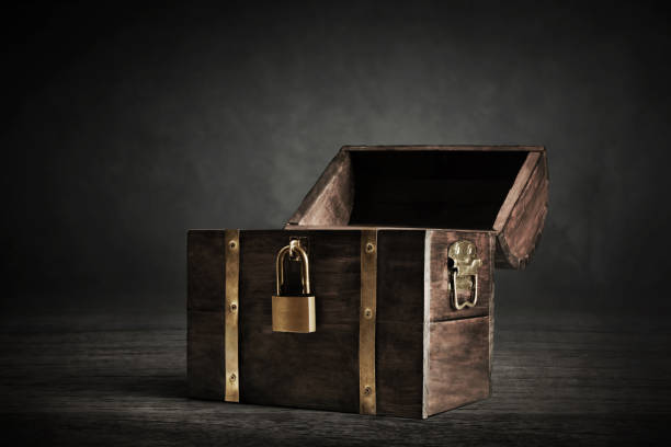 istock Wooden treasure chest on dark background 1353383783